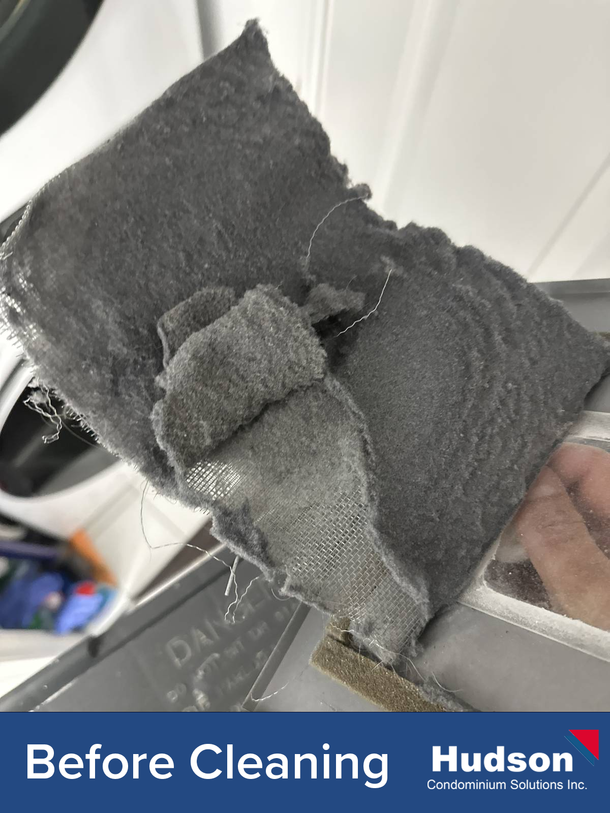 Dryer vent before cleaning showing lint buildup