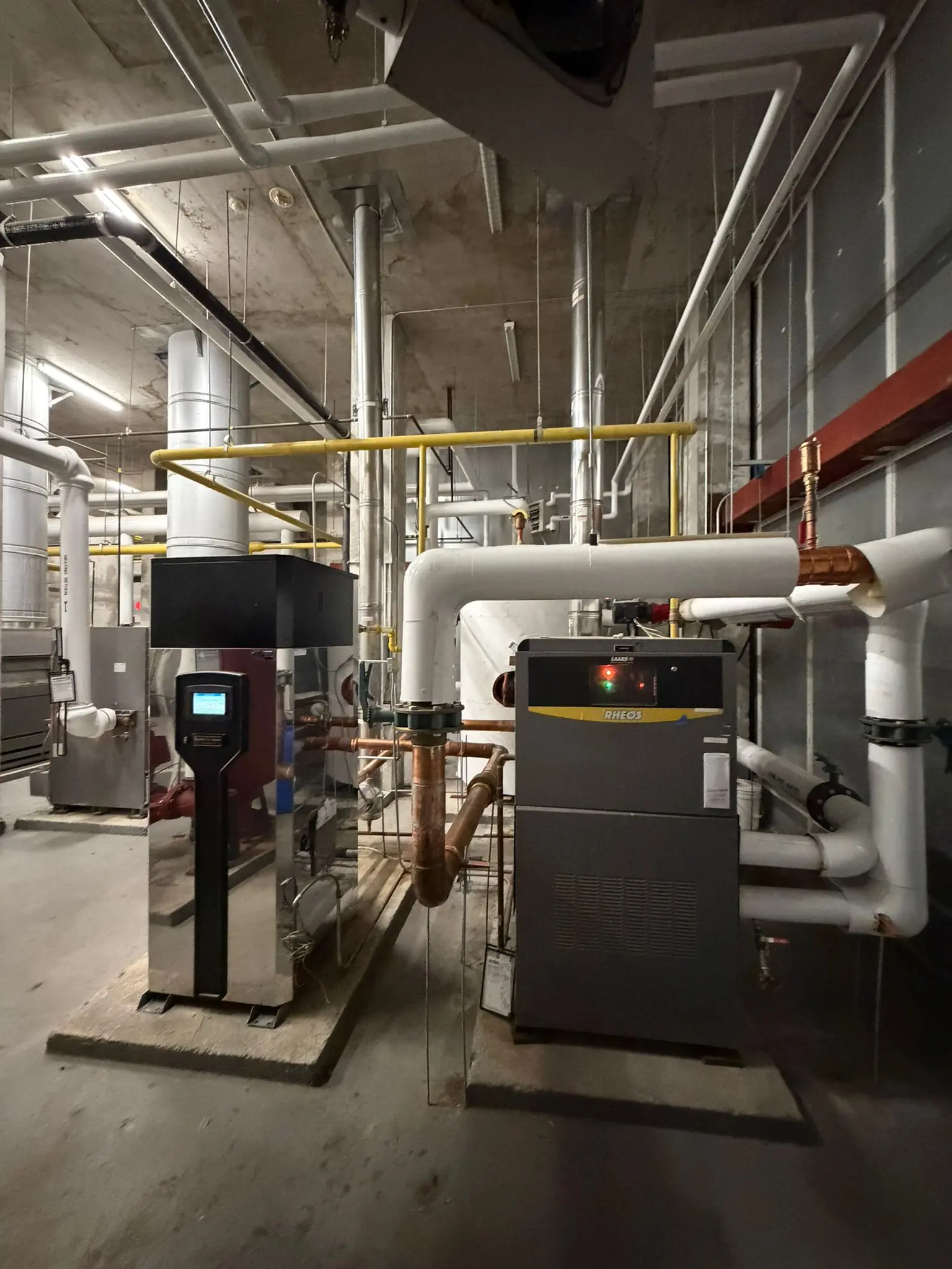 Boiler replacement work in a condo mechanical room
